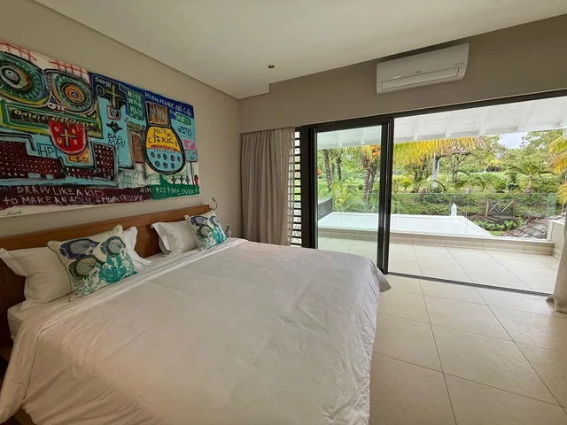 Villa Dei Melici, Double bedroom with colourful artwork