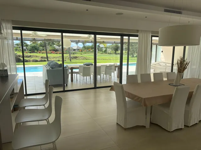 Villa Elysium — Dining room opening onto the terrace and golf course